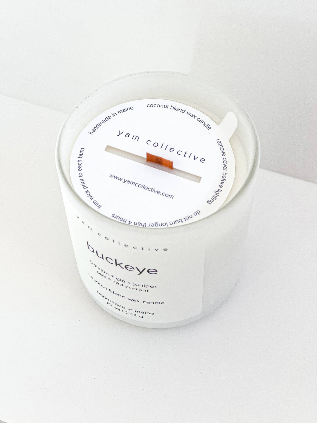 yam collective - Buckeye - 10 oz Juniper + Balsam Matte White Glass Candle - The Look and Co
