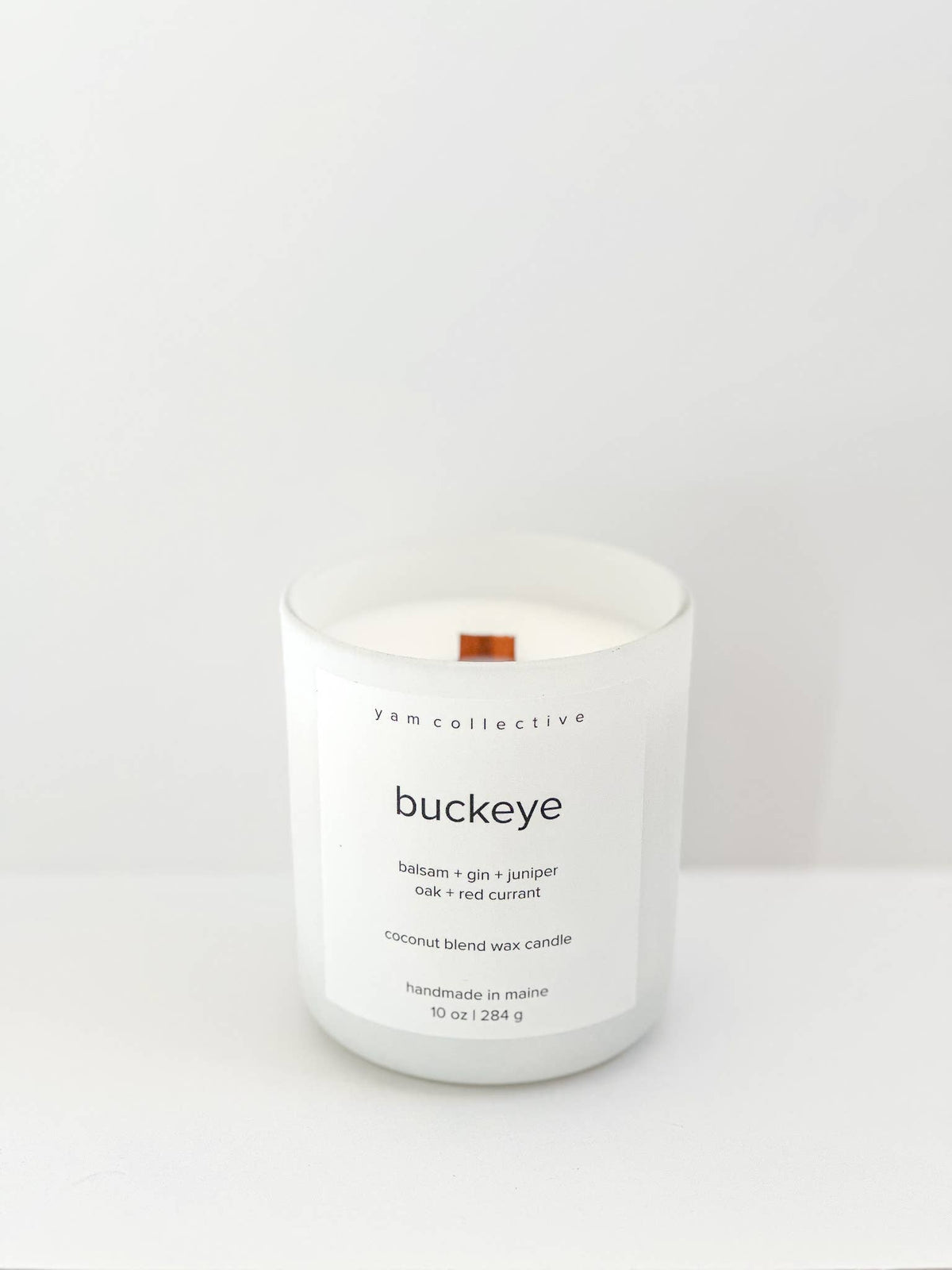 yam collective - Buckeye - 10 oz Juniper + Balsam Matte White Glass Candle - The Look and Co