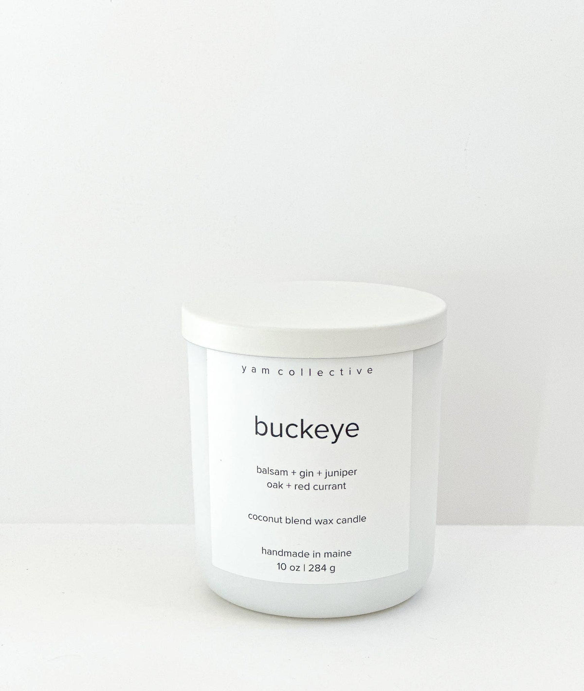 yam collective - Buckeye - 10 oz Juniper + Balsam Matte White Glass Candle - The Look and Co