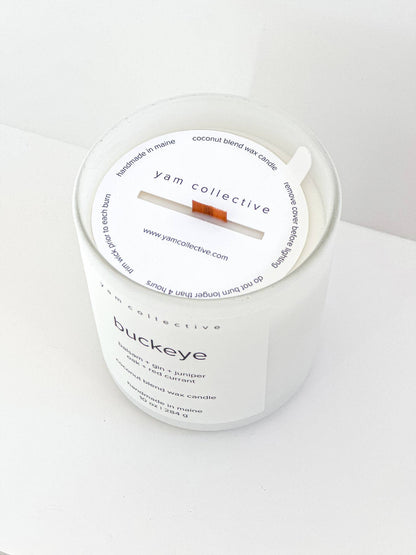 yam collective - Buckeye - 10 oz Juniper + Balsam Matte White Glass Candle - The Look and Co