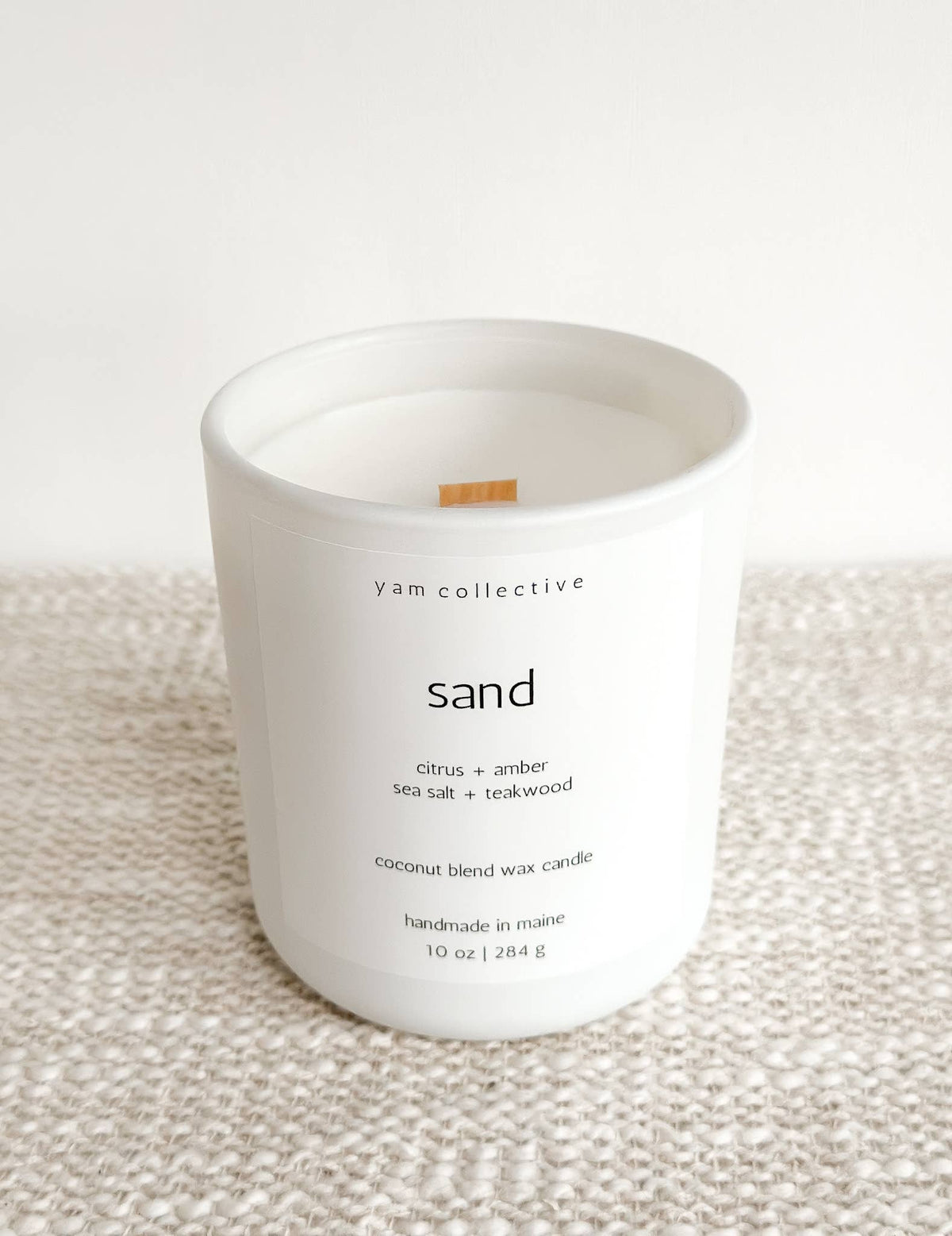 yam collective - Sand - 10 oz Amber + Teakwood Matte White Glass Candle - The Look and Co