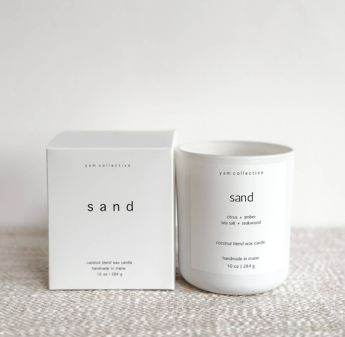 yam collective - Sand - 10 oz Amber + Teakwood Matte White Glass Candle - The Look and Co