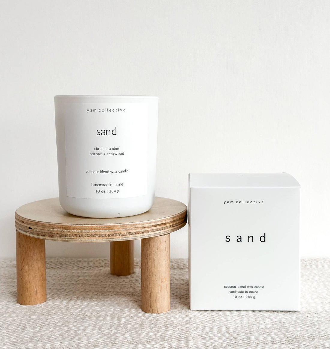 yam collective - Sand - 10 oz Amber + Teakwood Matte White Glass Candle - The Look and Co