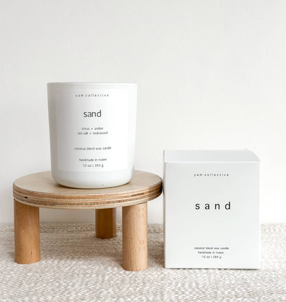 yam collective - Sand - 10 oz Amber + Teakwood Matte White Glass Candle - The Look and Co
